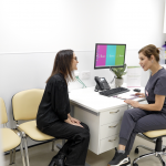 a returning patient having a consultation with one of our expert nurses at our Aesthetics clinics to achieve their skin goals